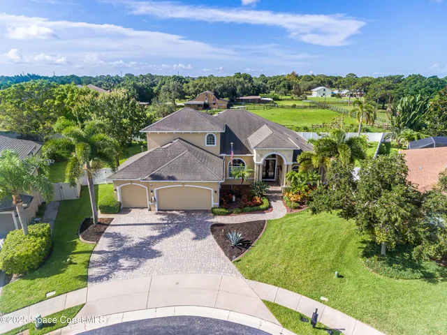 a aerial view of a house with a garden