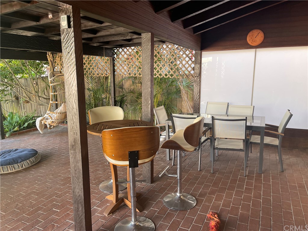 320 Park Avenue Long Beach, CA 90814 - Photo 7 of 8 a dining room with furniture and a floor to ceiling window