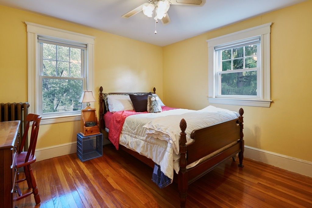 112 Bacon Street Natick, MA 01760 - Photo 15 of 20 a bedroom with a bed wooden floor and a window