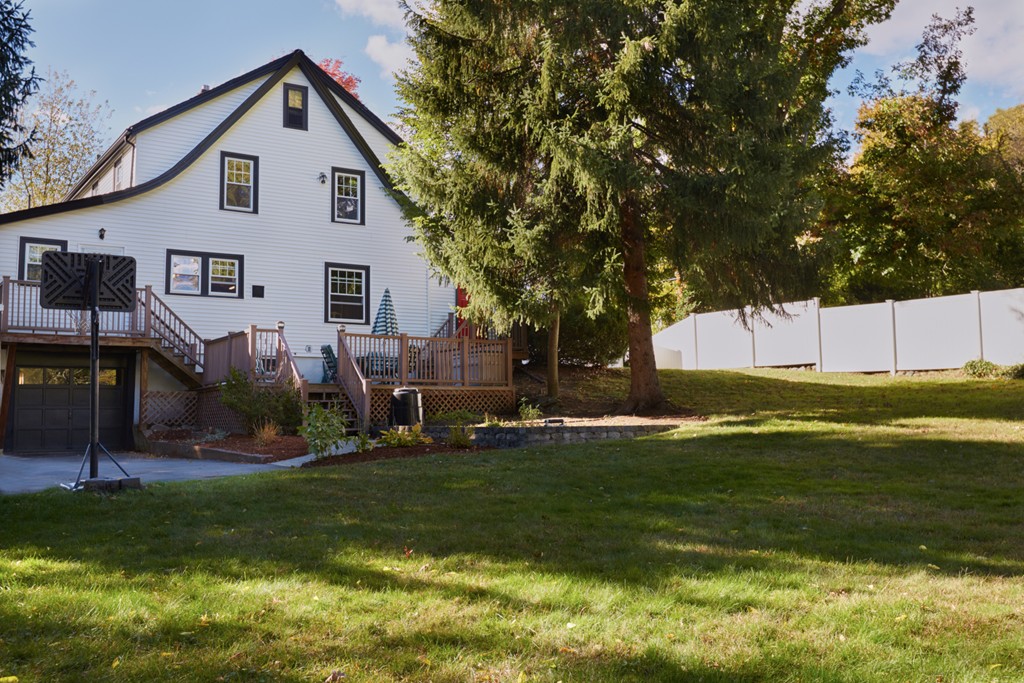 112 Bacon Street Natick, MA 01760 - Photo 20 of 20 a view of a house with a yard and sitting area