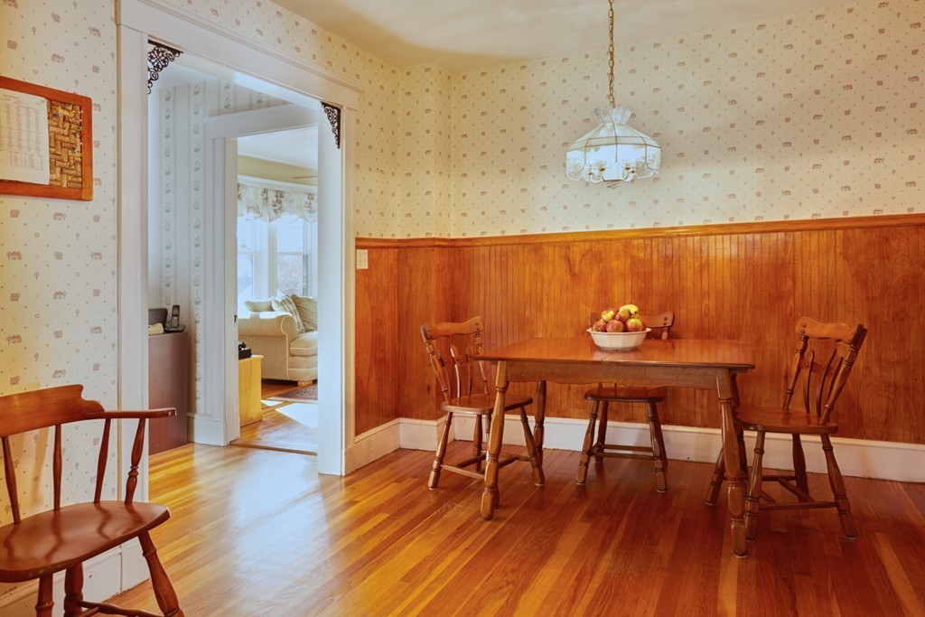 112 Bacon Street Natick, MA 01760 - Photo 4 of 20 a view of a dining room with furniture and wooden floor