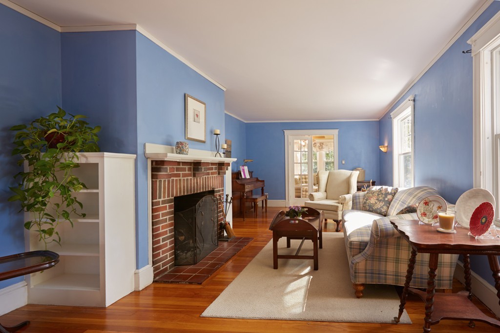 112 Bacon Street Natick, MA 01760 - Photo 5 of 20 a living room with furniture and a fireplace