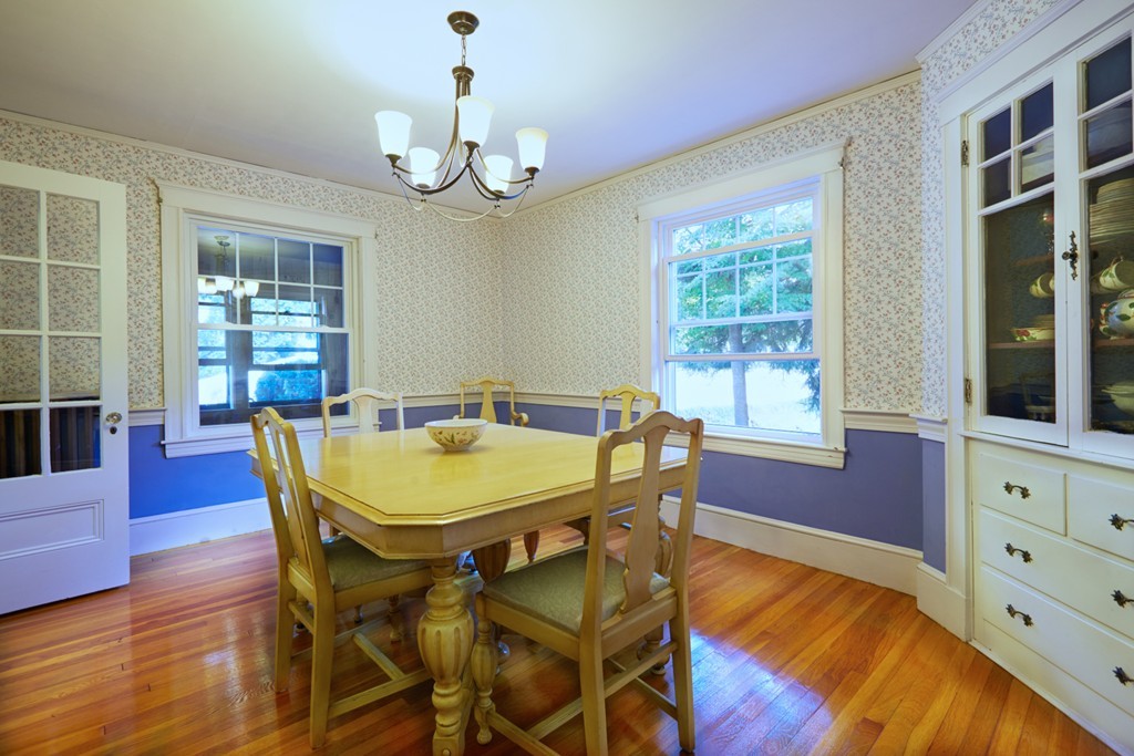 112 Bacon Street Natick, MA 01760 - Photo 7 of 20 a view of a dining room with furniture window and wooden floor