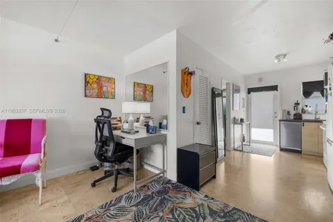 a view of a workspace with furniture and a living room