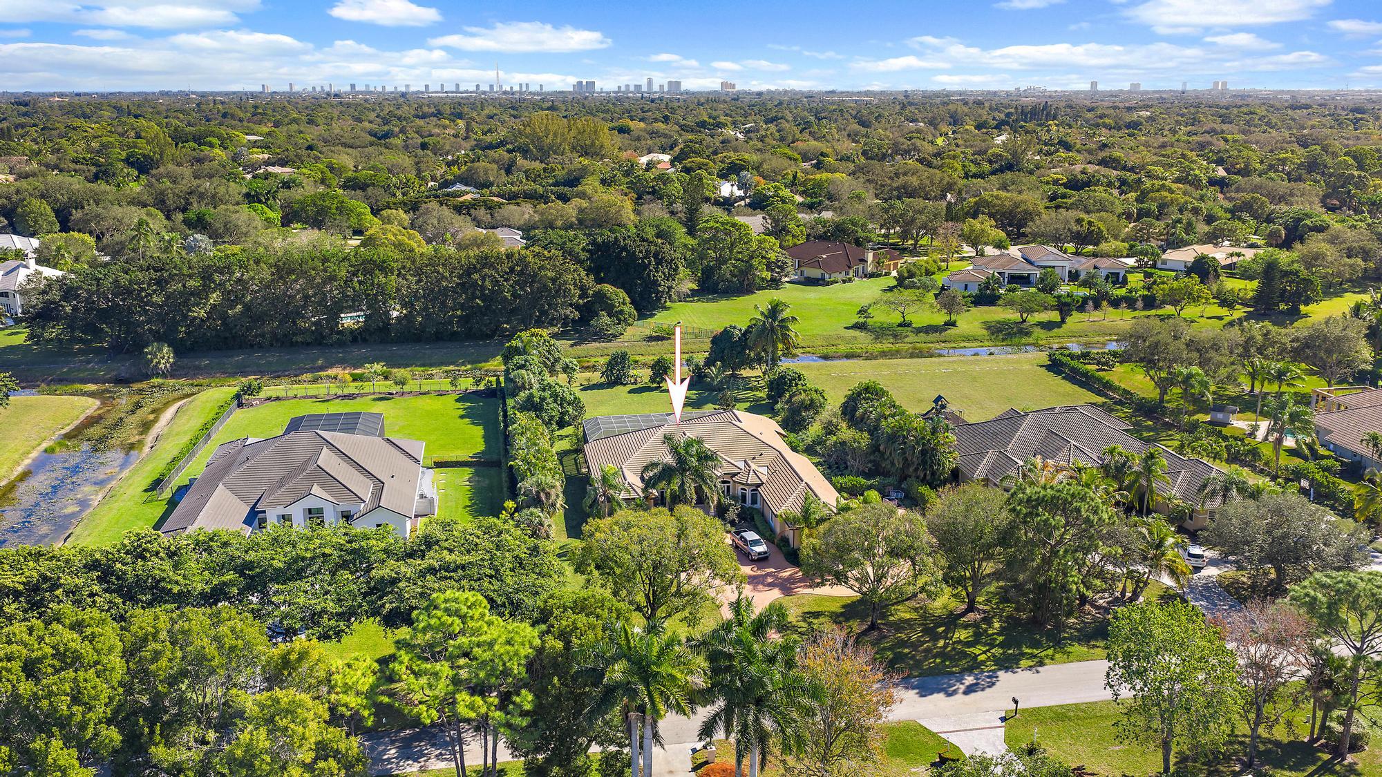 8480 Man O War Road Palm Beach Gardens, FL 33418 - Photo 41 of 45 an aerial view of a houses with a swimming pool