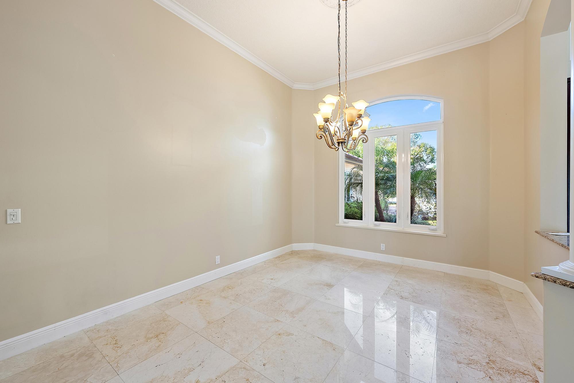 8480 Man O War Road Palm Beach Gardens, FL 33418 - Photo 5 of 45 a view of a chandelier in a room