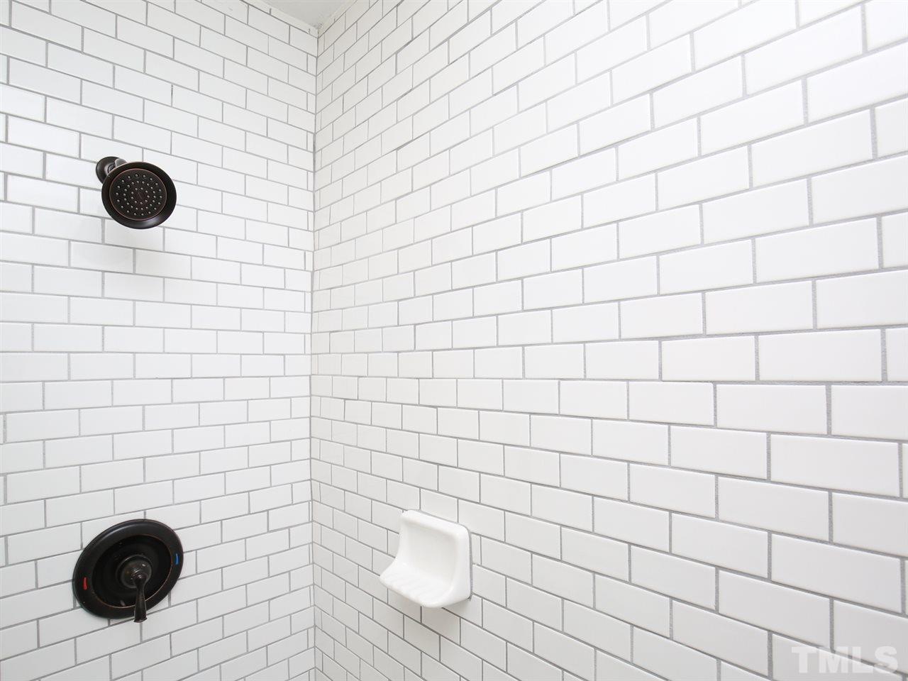 312 Colleton Road Raleigh, NC 27610 - Photo 19 of 25 a bathroom with a shower