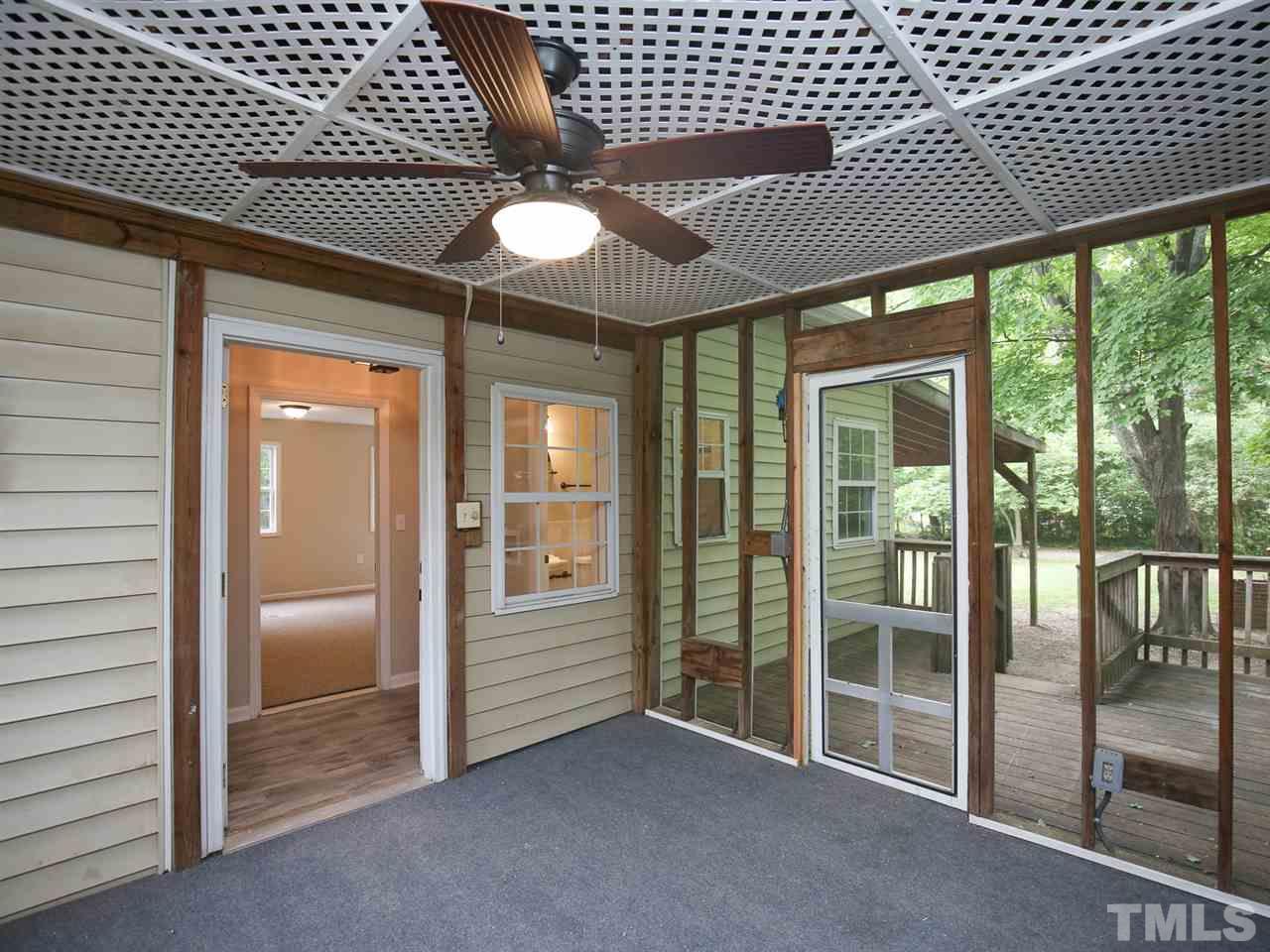 312 Colleton Road Raleigh, NC 27610 - Photo 20 of 25 an empty room with wooden floor and windows