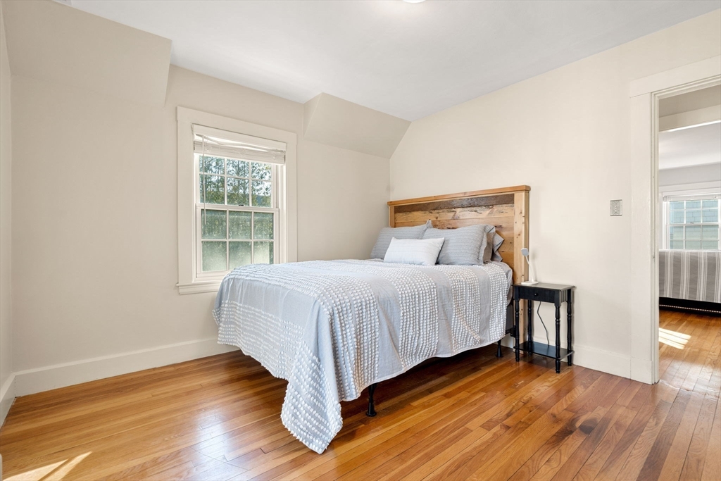 10 Pickwick Road Marblehead, MA 01945 - Photo 21 of 42 a bed sitting in a bedroom next to a window