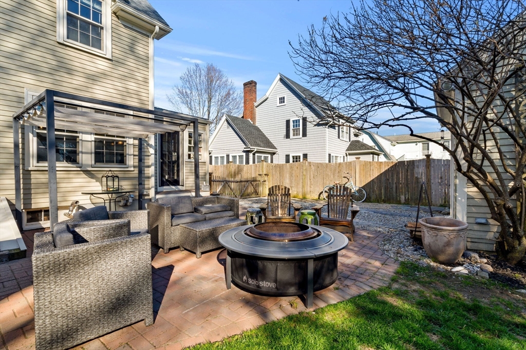 10 Pickwick Road Marblehead, MA 01945 - Photo 34 of 42 a view of a patio with couches table and chairs and potted plants