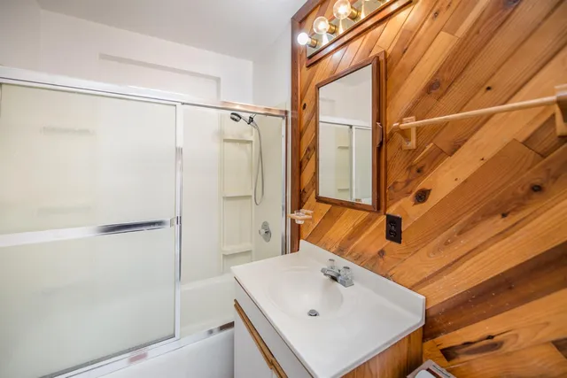 a bathroom with a sink and shower