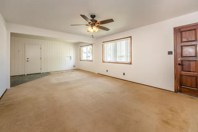 a view of an empty room with a window