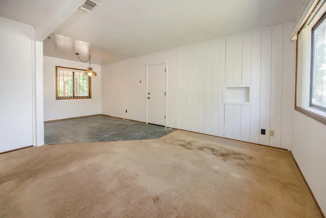 an empty room with windows