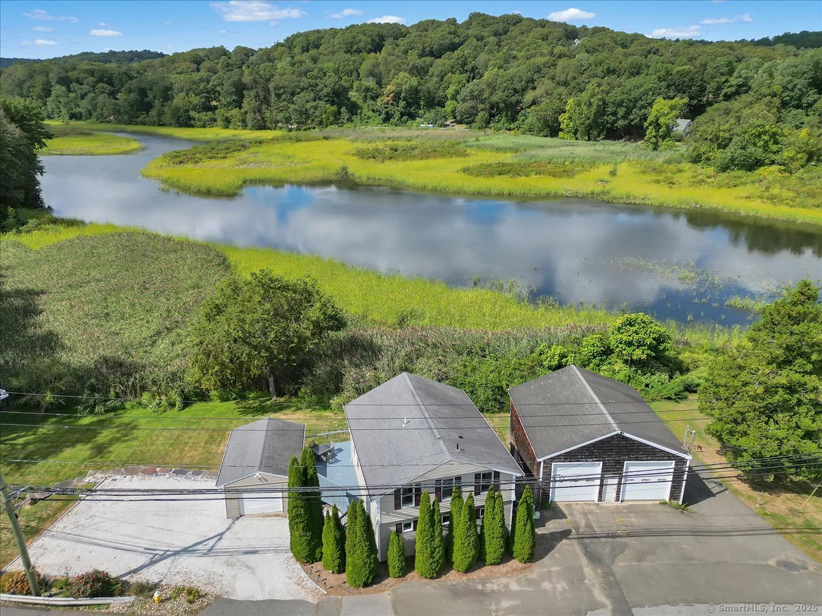 131 Middlesex Avenue Chester, CT 06412 - Photo 1 of 1 a view of a swimming pool with a yard and a lake view