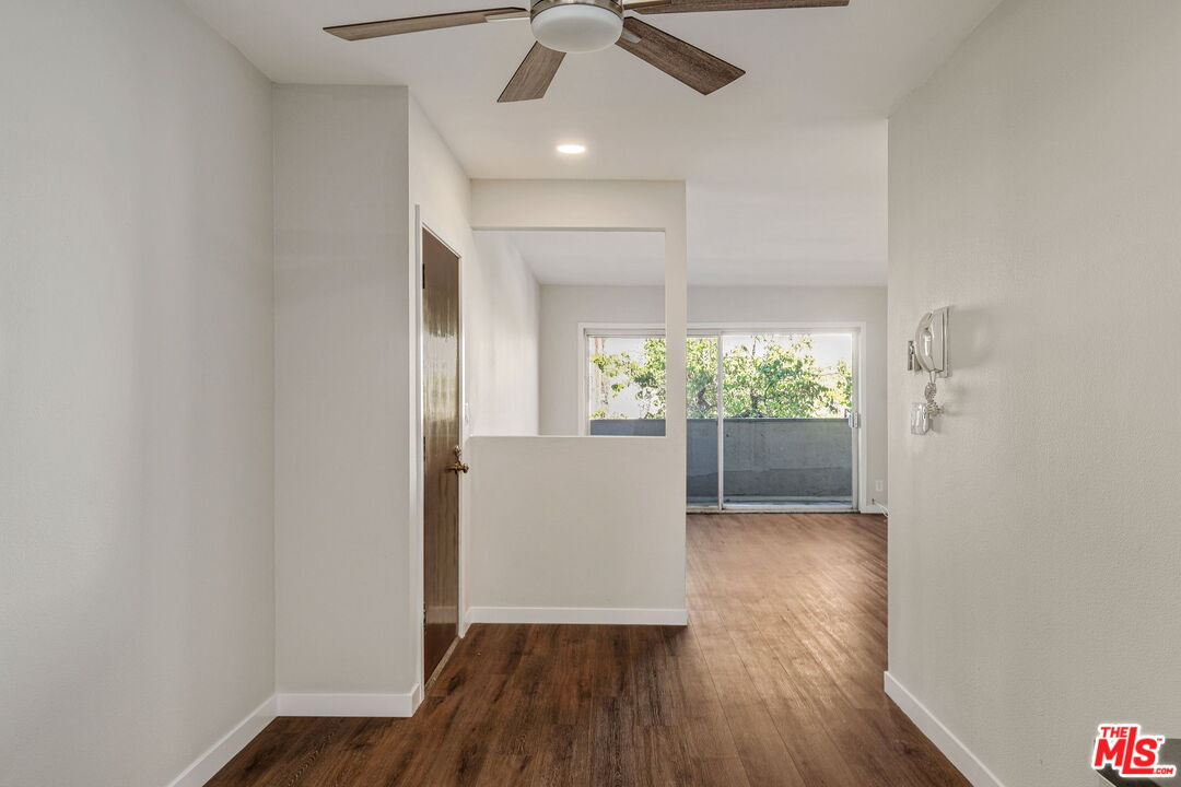 1342 Harvard Street, Unit 201 Santa Monica, CA 90404 - Photo 7 of 15 wooden floor in an empty room with a window