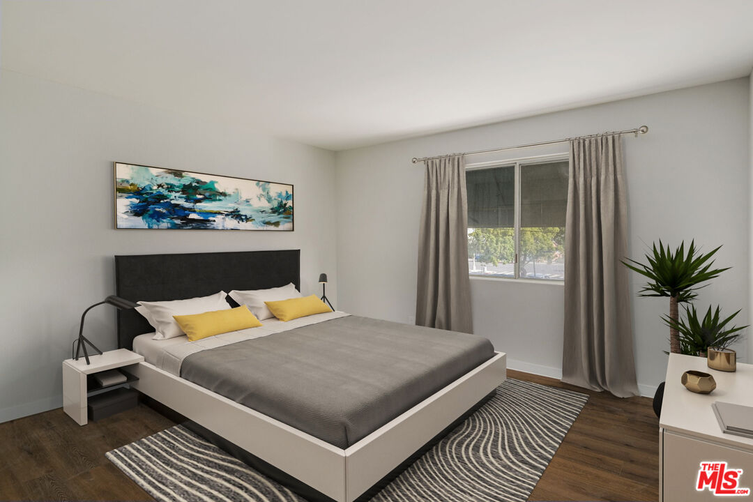 1342 Harvard Street, Unit 201 Santa Monica, CA 90404 - Photo 8 of 15 a bedroom with a bed and wooden floor