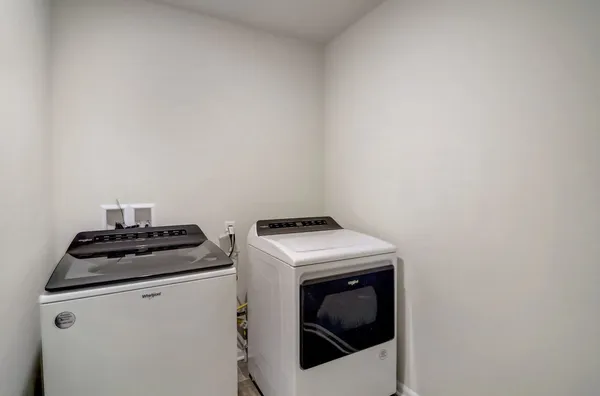 a stove top oven sitting inside of a kitchen