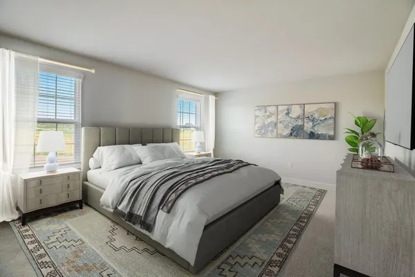 a bedroom with a large bed and a window