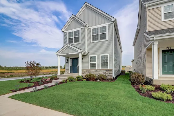 a front view of a house with a yard