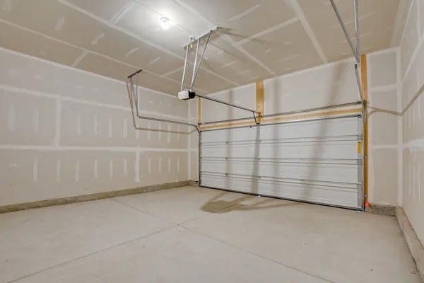 a view of a garage with an empty space