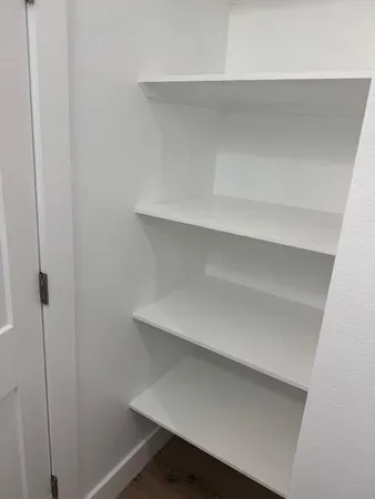 a bathroom with a double vanity sink and mirror