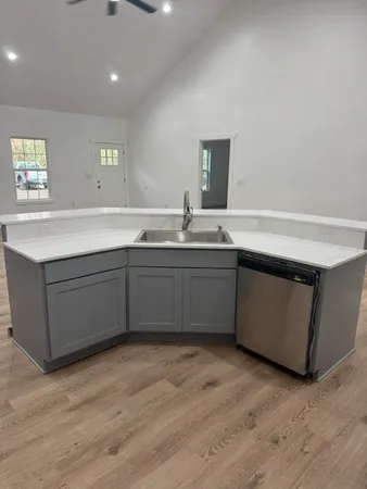 a kitchen with a sink and cabinets