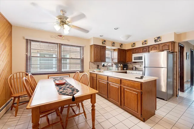 a dining room with furniture and window