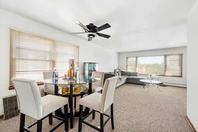 a view of a dining room with furniture window and outside view