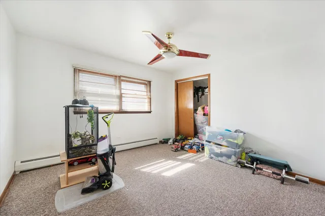 a room with gym equipment and windows