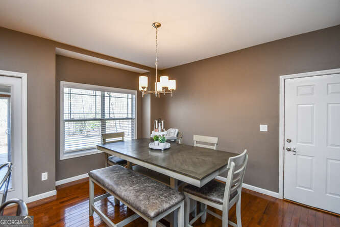 290 Eli Knob Road Dahlonega, GA 30533 - Photo 17 of 87 a view of a dining room with furniture window and wooden floor