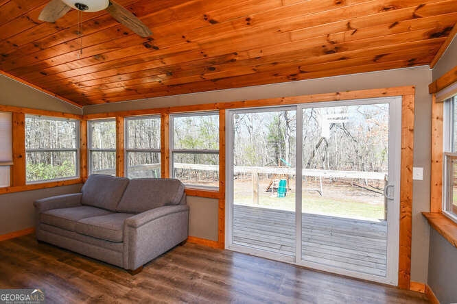 290 Eli Knob Road Dahlonega, GA 30533 - Photo 19 of 87 a living room with furniture and a large window
