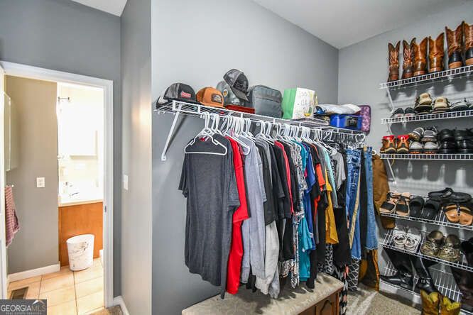 290 Eli Knob Road Dahlonega, GA 30533 - Photo 33 of 87 a view of walk in closet with clothes and shoes