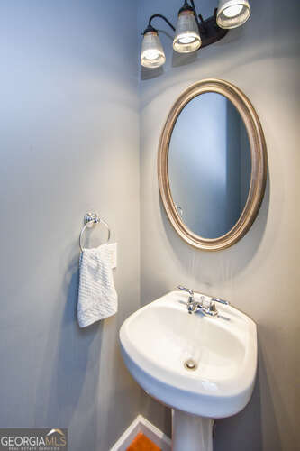 290 Eli Knob Road Dahlonega, GA 30533 - Photo 37 of 87 a bathroom with a sink and a mirror