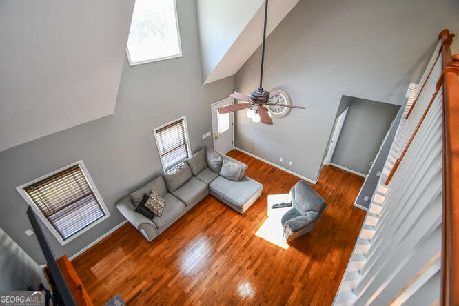 290 Eli Knob Road Dahlonega, GA 30533 - Photo 39 of 87 a living room with furniture and floor to ceiling windows