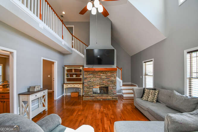 290 Eli Knob Road Dahlonega, GA 30533 - Photo 4 of 87 a living room with fireplace furniture and a flat screen tv