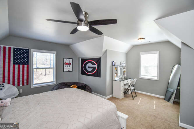 290 Eli Knob Road Dahlonega, GA 30533 - Photo 45 of 87 a bedroom with a bed and a window