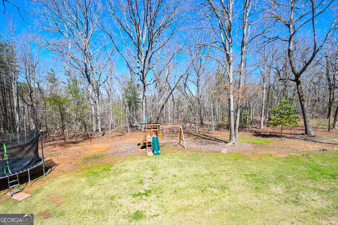 290 Eli Knob Road Dahlonega, GA 30533 - Photo 57 of 87 a view of a park with swings and slides