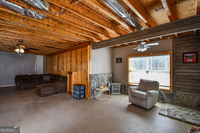 290 Eli Knob Road Dahlonega, GA 30533 - Photo 65 of 87 a living room with furniture and a window