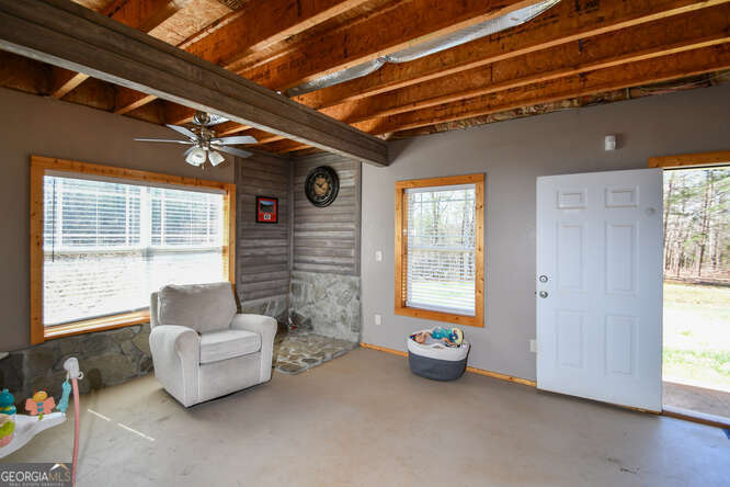 290 Eli Knob Road Dahlonega, GA 30533 - Photo 67 of 87 a living room with furniture and a window