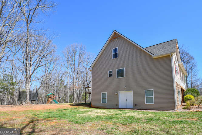 290 Eli Knob Road Dahlonega, GA 30533 - Photo 77 of 87 a backyard of a house with large trees