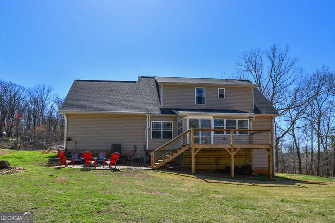 290 Eli Knob Road Dahlonega, GA 30533 - Photo 83 of 87 a view of a house with a yard and a wooden fence