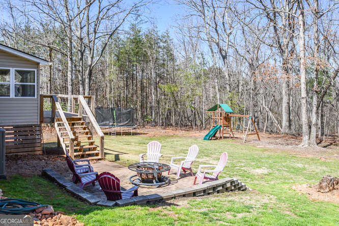 290 Eli Knob Road Dahlonega, GA 30533 - Photo 85 of 87 a view of a swimming pool with sitting area and furniture
