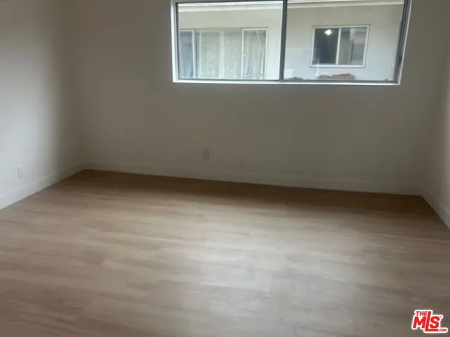 a view of a room that has a window