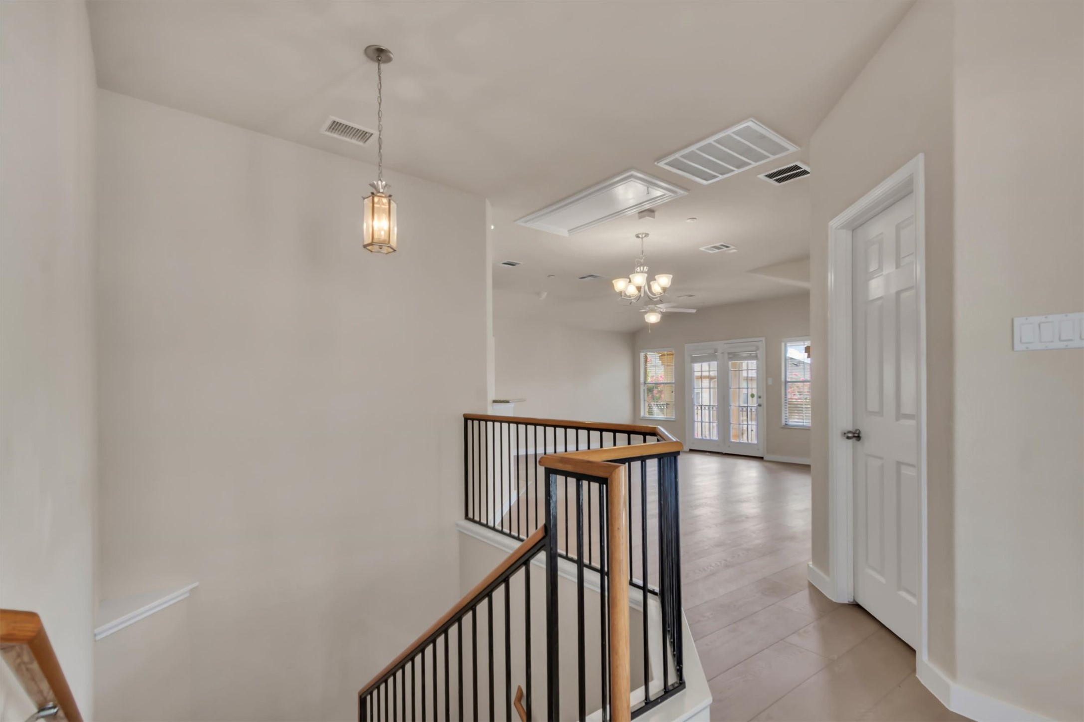 14815 Avery Ranch Boulevard, Unit 2A Austin, TX 78717 - Photo 9 of 27 A split-level landing area provides a transition from the lower entry to the airy main living spaces.