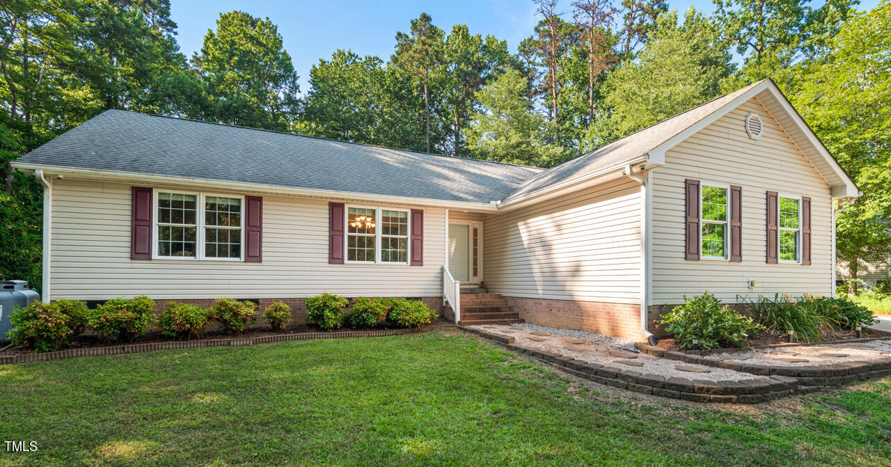 2023 Antioch Church Road Timberlake, NC 27583 - Photo 1 of 40 a view of a house with backyard and garden