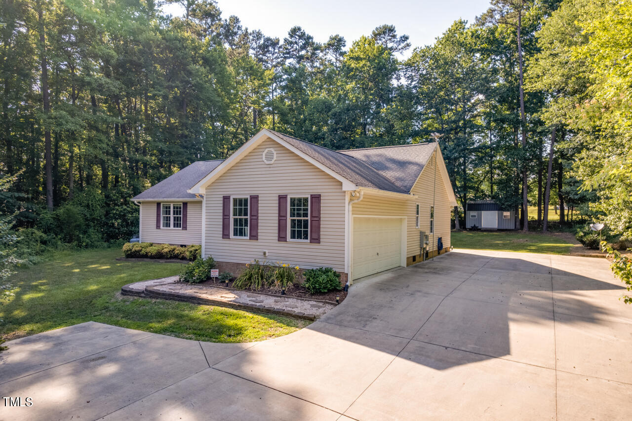 2023 Antioch Church Road Timberlake, NC 27583 - Photo 36 of 40 a view of front of house with a yard