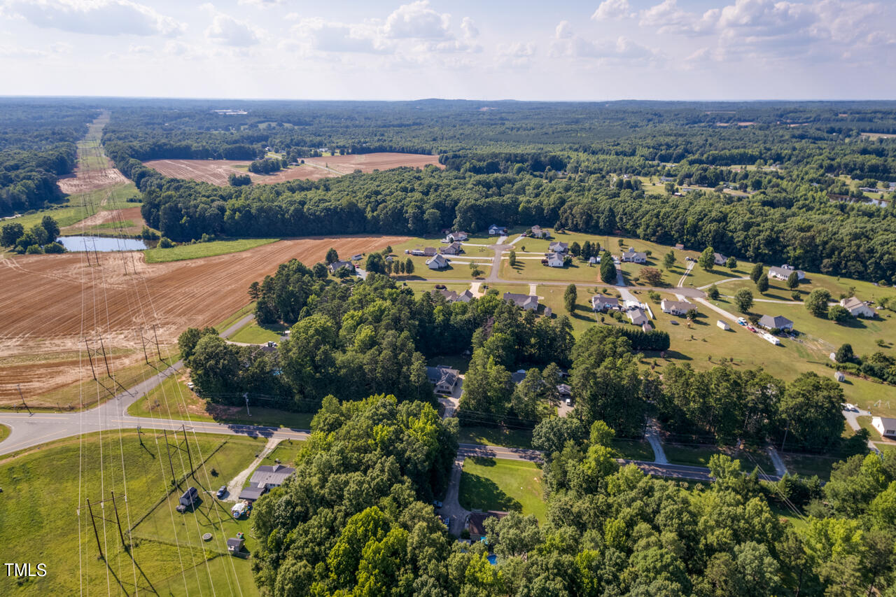 2023 Antioch Church Road Timberlake, NC 27583 - Photo 40 of 40 an aerial view of a house with a garden