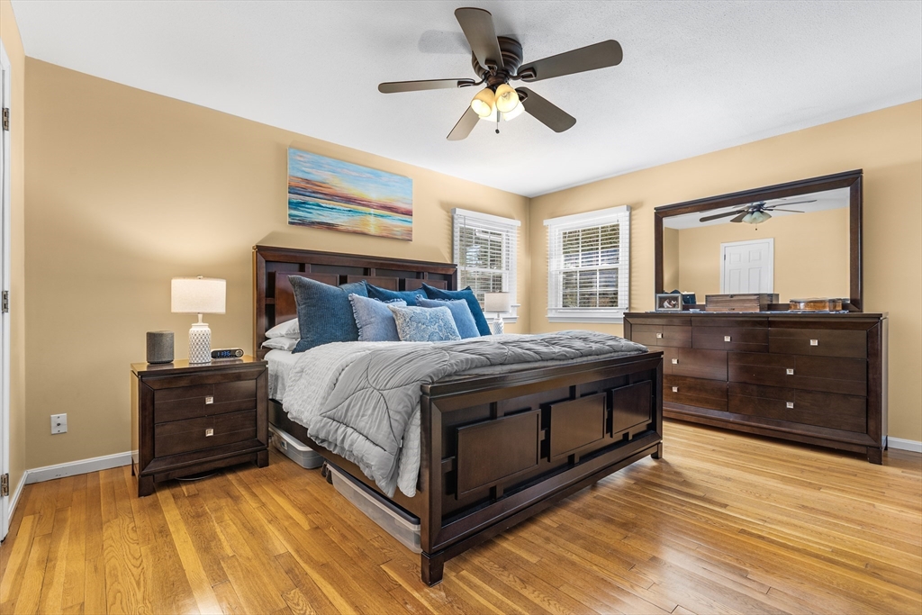 27 Audubon Road Reading, MA 01867 - Photo 15 of 35 a spacious bedroom with a bed and a dresser