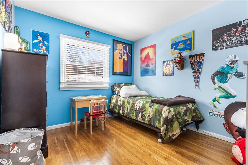 27 Audubon Road Reading, MA 01867 - Photo 21 of 35 a bedroom that has a bed and a chair in it