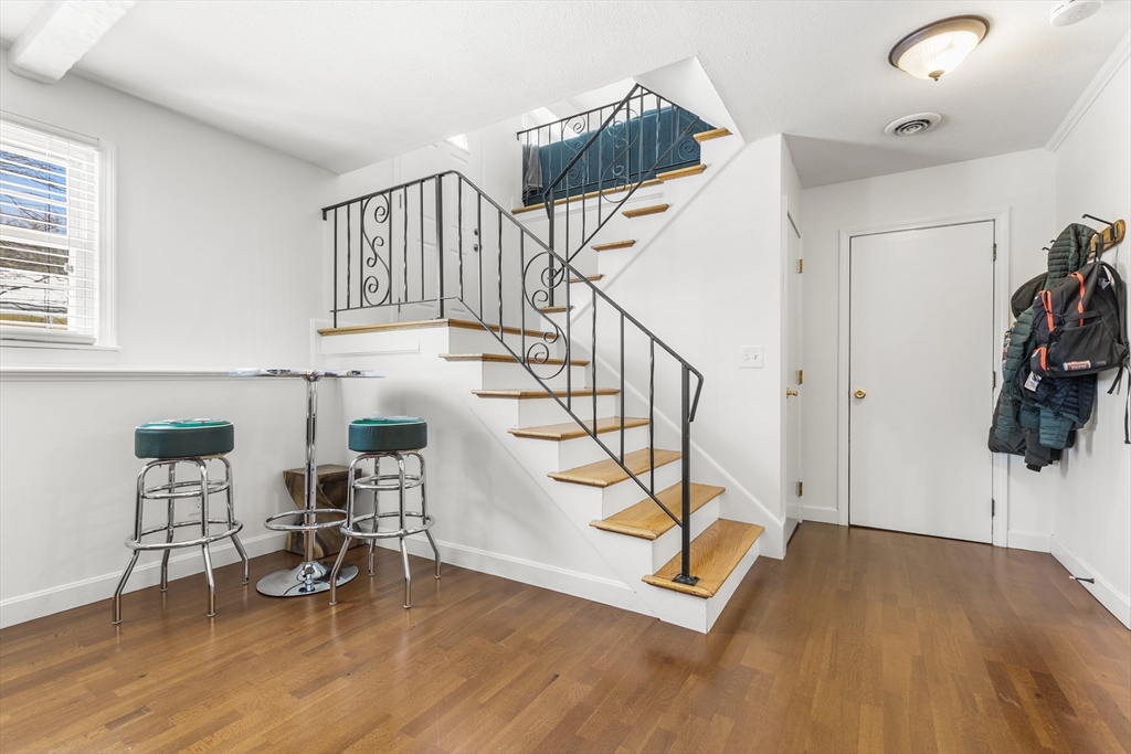 27 Audubon Road Reading, MA 01867 - Photo 22 of 35 a view of entryway and hall with wooden floor
